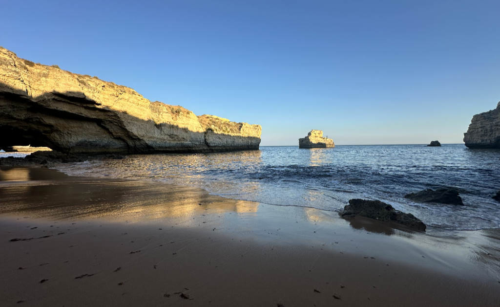 A photo of a secret bay in Portugal at sunset.