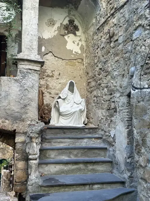 One of the pieces of art, showing an empty cape – I think it shows Maria holding Jesus, but without Maria and Jesus, but just her cloths