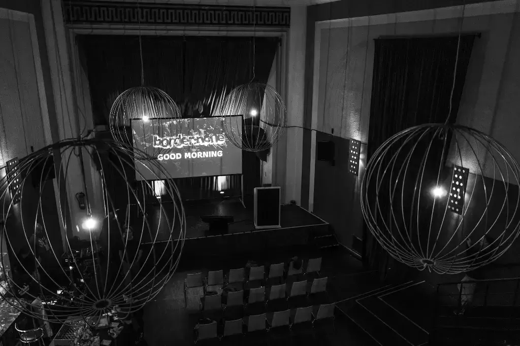 The Orpheum, theatre for border:none, shot from balcony and showing stage and the beautiful lamps